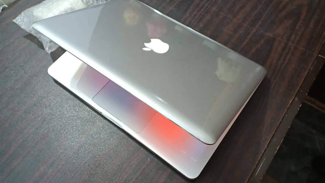 APPLE MACBOOK PRO WITH LIGHT KEYBOARD AND LOGO