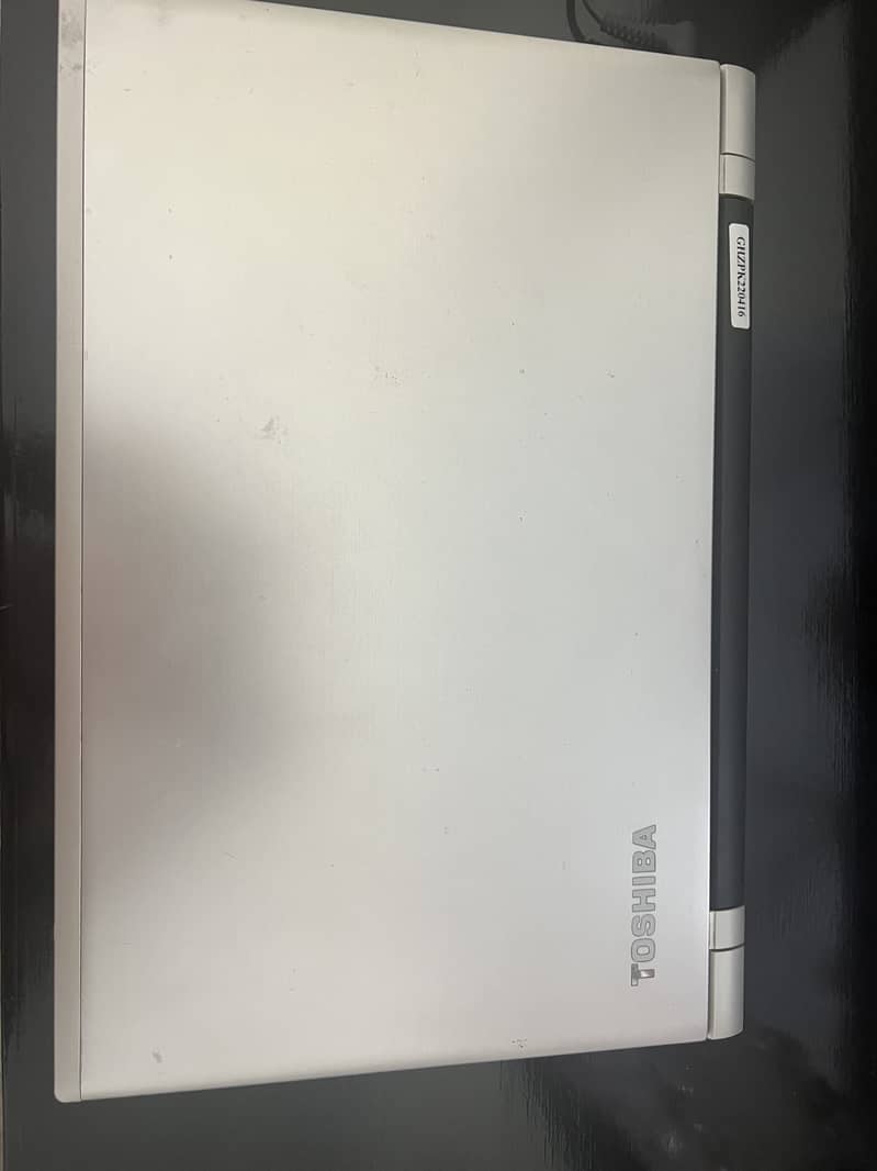 Silver coloured Toshiba laptop with 101GB storage for sale.