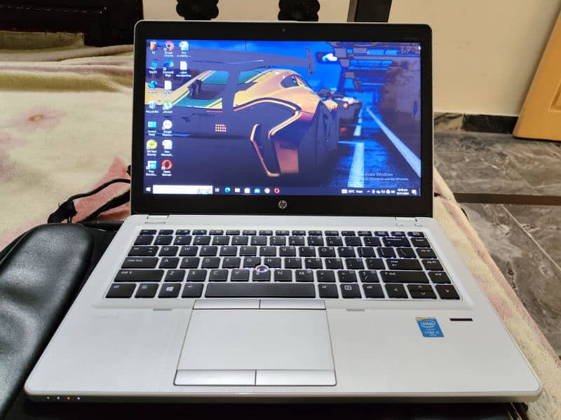 perfect condition hp folio 9480p. slim book , silver color